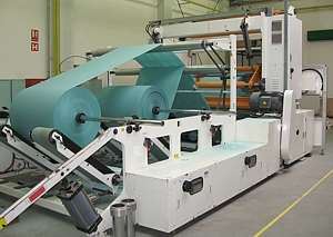 The longitudinal cutting and rewinding of paper, textiles and foil