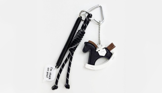 A vintage-inspired rocking horse charm keyring in black and brown tones. Accented with chocolate and...