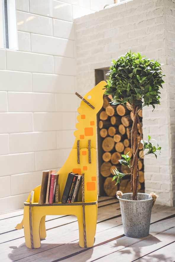 A little giraffe carrying the books.Giraffe bookshelf is made with Tri-wall corrugated cardboard for...