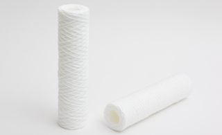 PRESSED CARTRIDGES FOR STEP PROCESS FILTRATION PROCESSES