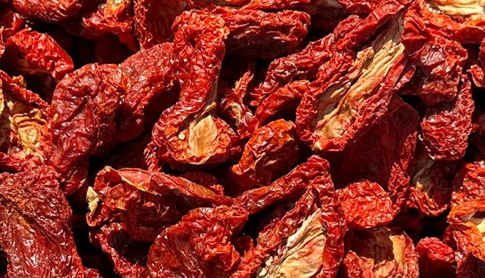 Sun-dried tomatoes start out as ripe tomatoes. They are then pre-treated with salt or sulfur dioxide...