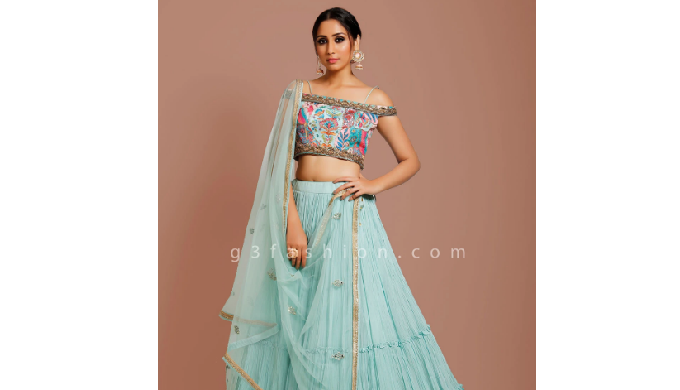Get compliments from onlookers in wedding functions by adorning this sea green georgette lehenga cho...