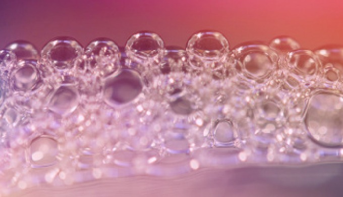 Water treatment using defoamers that minimize the harmful effects of trapped air, surface foam and s...