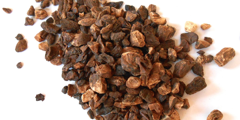 After completion of drying process, the dried roots further cut into slices and then roasted with ba...