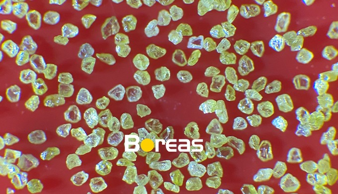 DESCRIPTION Characteristics: Golden color monocrystalline particle, blocky ...