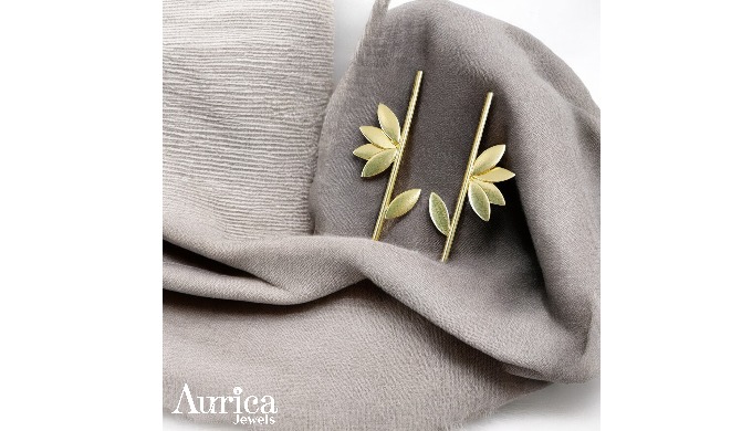 The Petal Grace earrings showcase a minimalist design that celebrates natural elegance. With smooth,...
