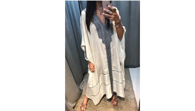 A modest silhouette that includes V-neck batwing flowy closed vogue. Jalabiya Dubai crafted from cry...