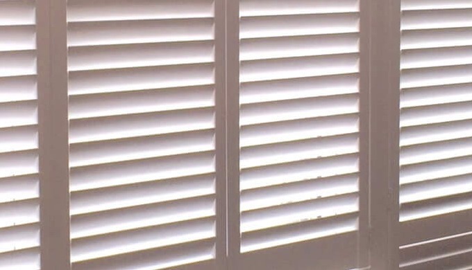 Café style shutters go halfway up the window, leaving the top of your window clear for the sun to ea...