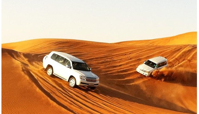 30 Mins Dune Drive in 4×4 Land Cruiser Short Camel Ride Sand Boarding Unlimited Water, Soft drinks T...