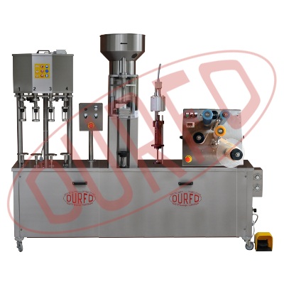 Linea semiautomatica per riempimento, tappatura con tappo a raso collo, capsulatura ed etichettatura...