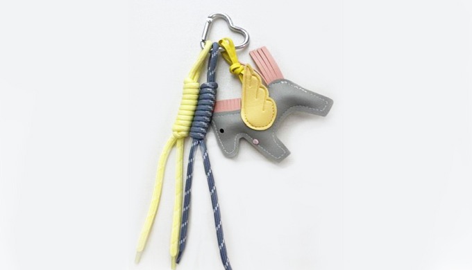 A whimsical Pegasus-shaped charm keyring with a carabiner and strap, perfect for attacting to bags o...