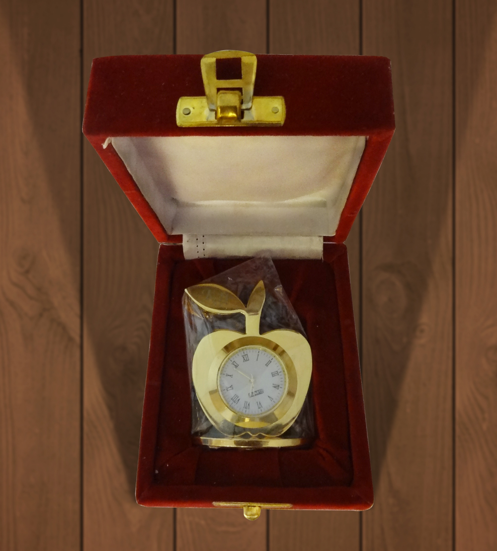 The Apple Table Clock is a piece of modern art infusing the daily use item with a traditional golden...
