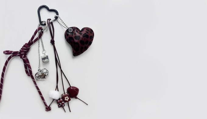 A stylish keyring featuring heart charms and pendants, perfect for adding a touch of character to ba...