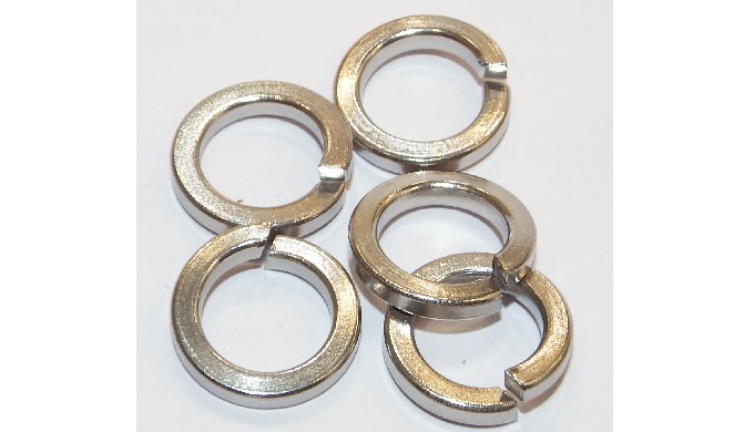 Standard Spring lock washers provide the requried seating and bearing surface used under a cap screw...