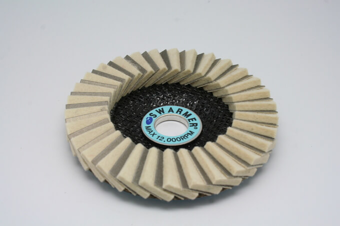 Diamond coated flexible polishing sheet is installed in a hand grinder for semi-Grinding and polishi...