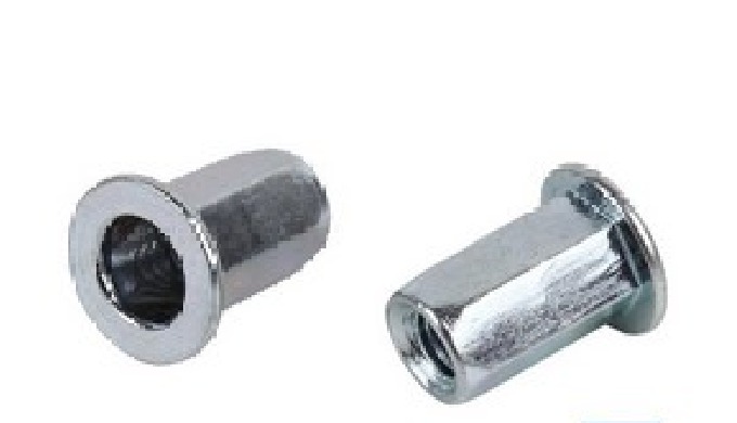 Rivet nut with semi-hexagonal head.