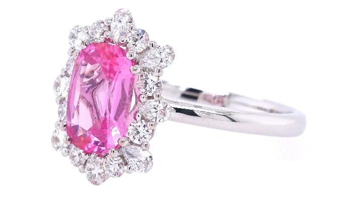 Unheated natural pink modified step cut spinel from Tanzania, surrounded by white round and pear cut...