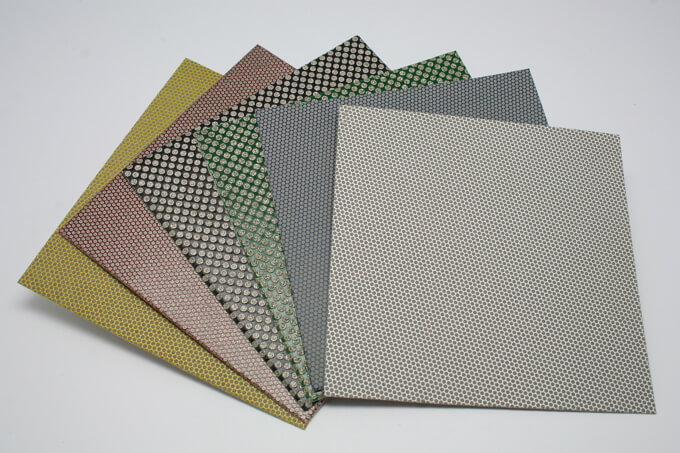 Diamond coated flexible polishing sheet is installed in a hand grinder for Grinding and polishing on...