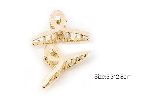 A set of hair accessories that includes mini claw clips and snap clips. With unique designs and a va...