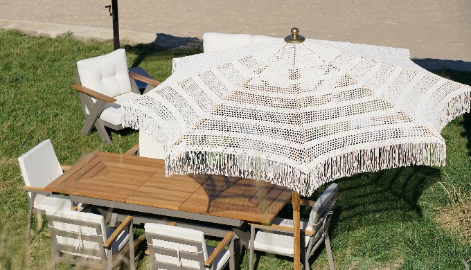 This is our Macrame model 2,5 meters round umbrella with Iroco wooden body İt's %100 natural and mac...
