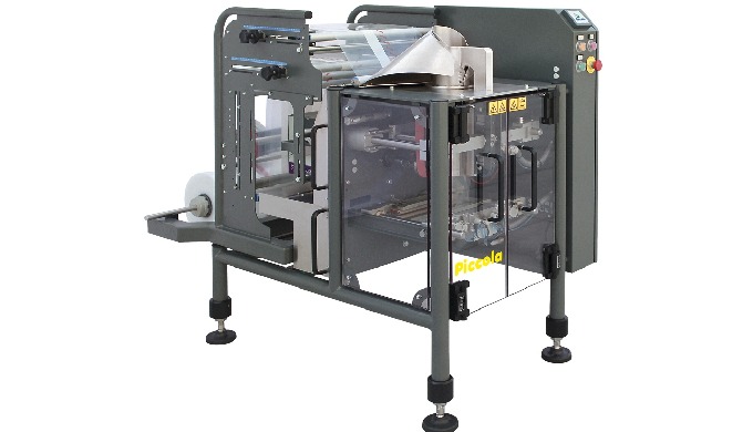 We were wondering what would be the most appropriate name for this packaging machine, which is an ey...
