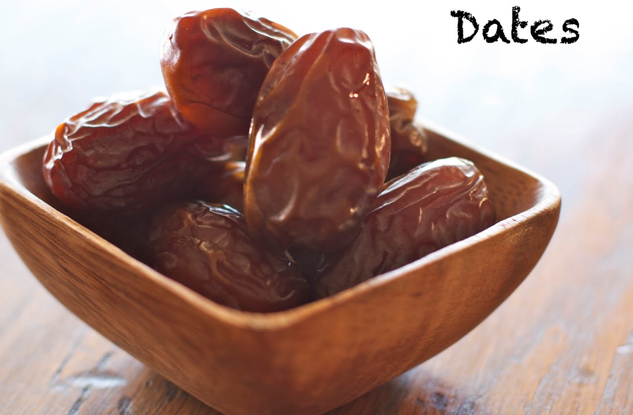 Date is a dark reddish, brown oval fruits. The fully ripe date is plump, with golden brown smooth sk...