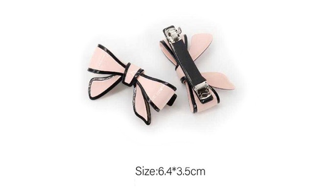 A hair pin set featuring a classic banana pin and a lovely ribbon clip. The calm colors and clean de...