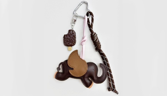 This keyring features a flying elephant charm with playful details. Colorful accents like hearts, st...