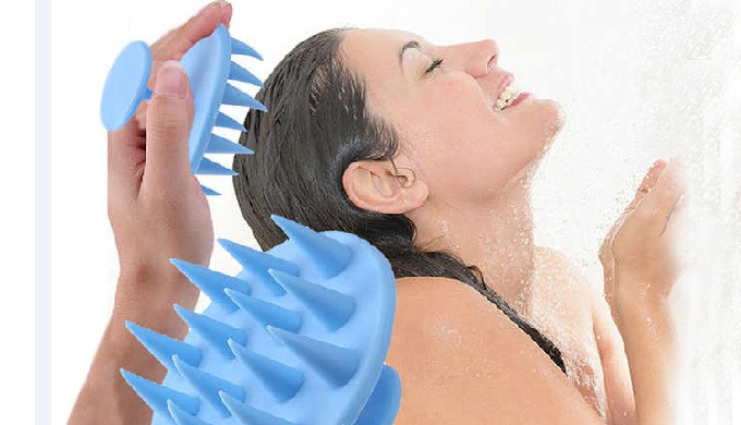 A silicone scalp massager that gently stimulates the scalp, helping to remove buildup and improve bl...