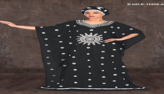 Elegant black Farasha kaftan featuring intricate white embroidery and matching headwrap – ideal for ...