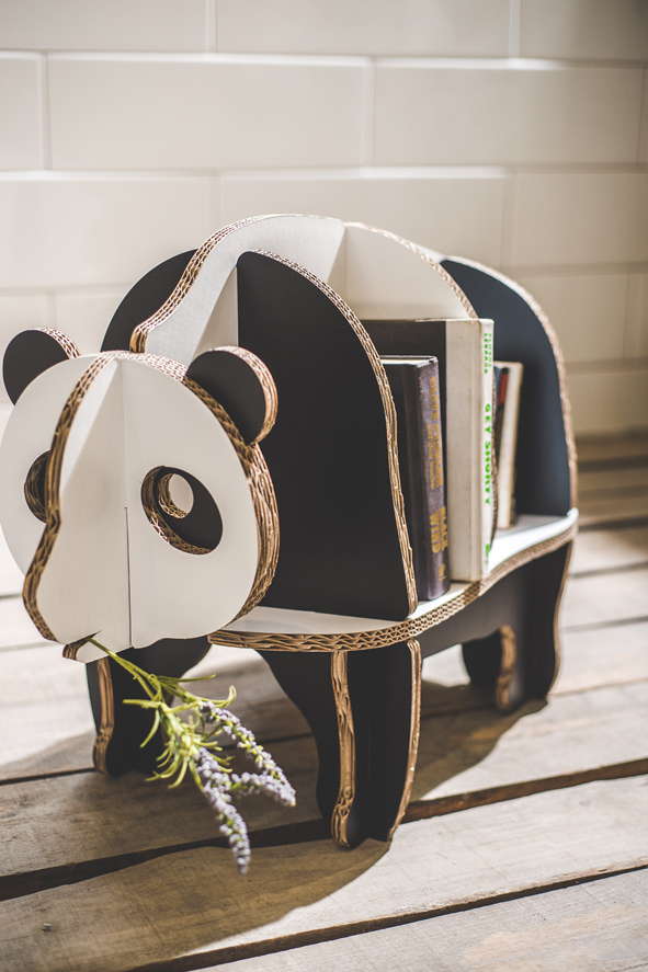 A little panda carrying the books.Panda bookshelf is made with Tri-wall corrugated cardboard for ext...