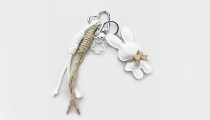 A cute bunny-shaped charm keyring with a ribbon detail, complete with a carabiner and strap for easy...