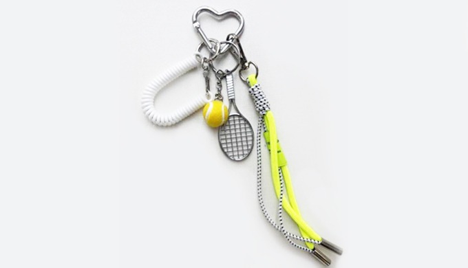 A sporty keyring featuring charms like tennis rackets, balls, and baseball gloves. Perfect for addin...