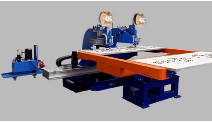 View of a 4-axis rotary table machine with 2 machines riveting simultaneously to loading and unloadi...