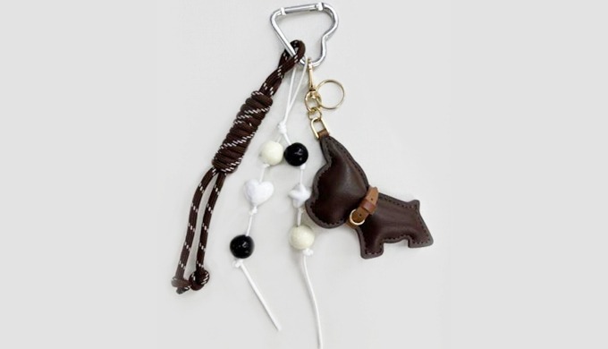 A charming keyring featuring animal-inspired designs such as dogs, bears, and leopard patterns, comb...