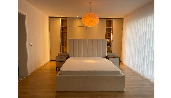 A modern bedroom designed with a perfect combination of elegance, comfort, and functionality. Every ...