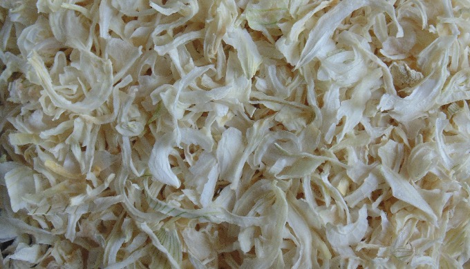 The fresh white onion bulbs are washed, sorted, cut, cleaned, and air-dried. Then, before cutting or...