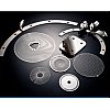 Laminated shims form a rigid structure that functions as a solid but may be reduced to a precise thi...